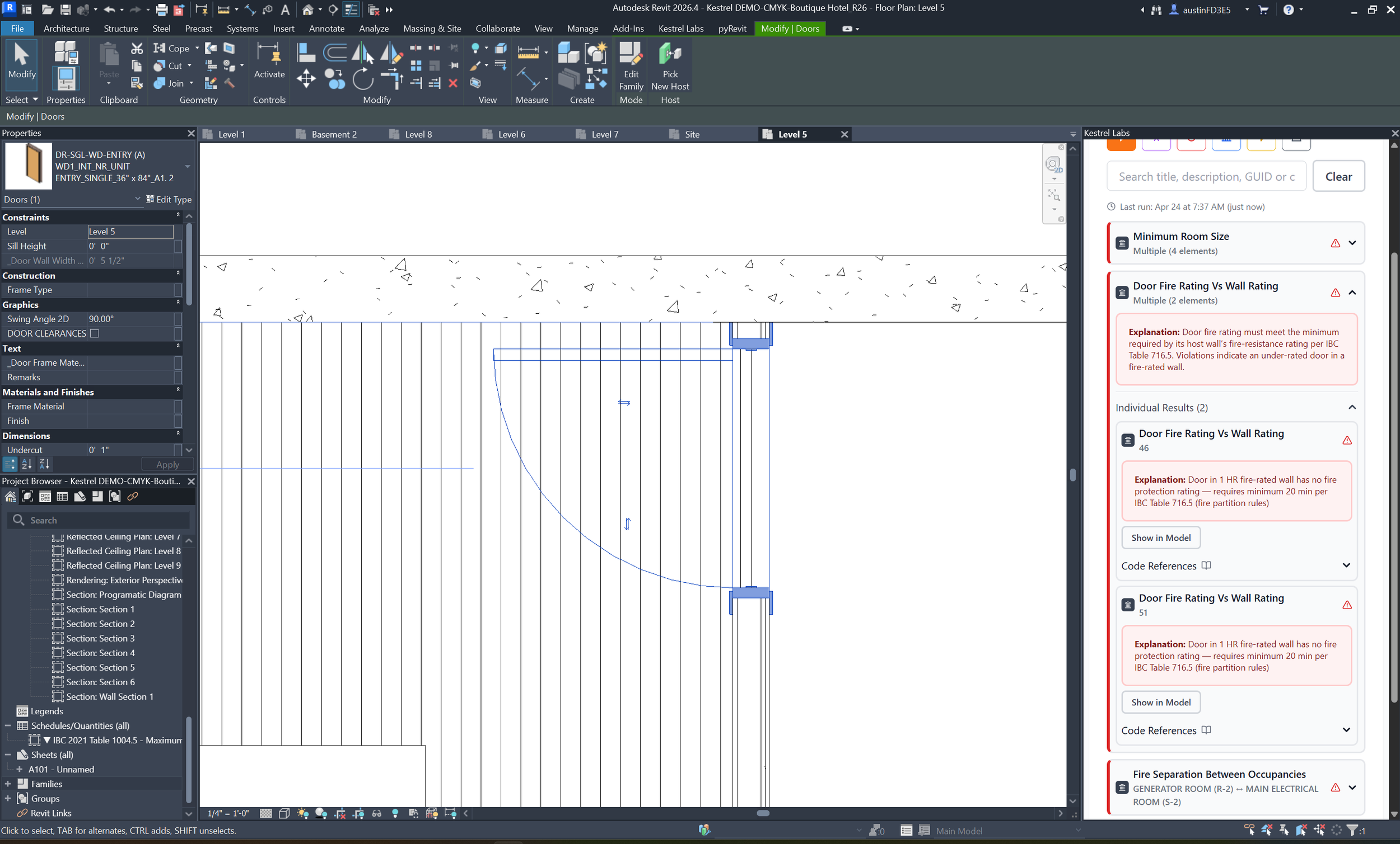 BIM model showing building code compliance issues flagged with code references.
